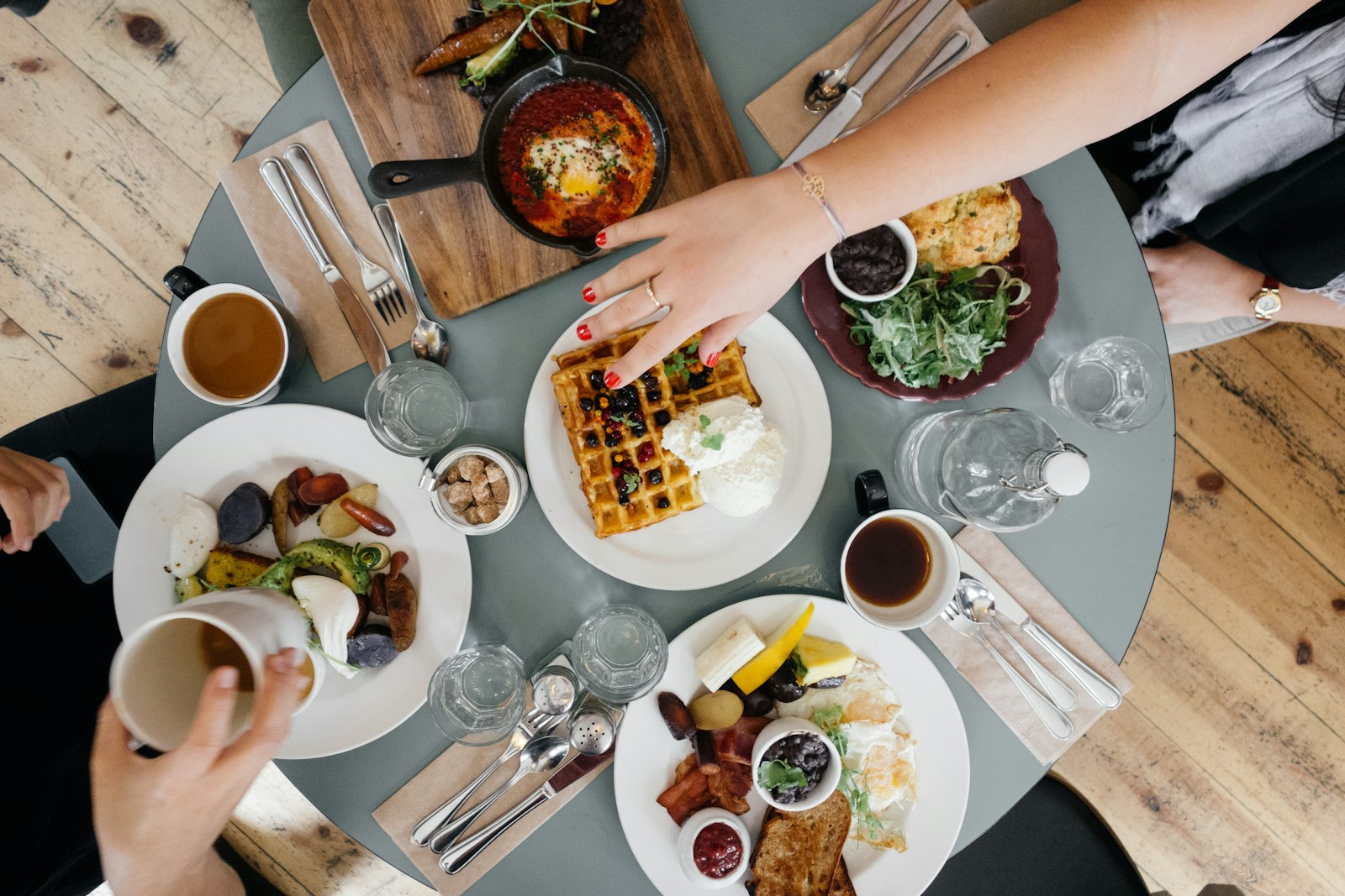 Hands over a shared table mid-celebration
